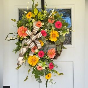 Vibrant Floral Wreath with Striped Bow